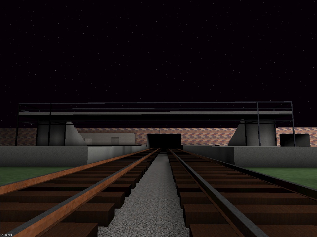 The passenger footbridge now has (some) railings and credible metal support frame.